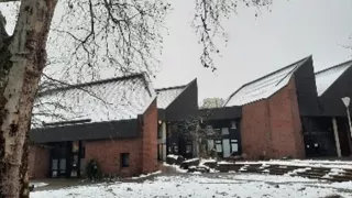 Snow-covered building where the Café International is located in.
