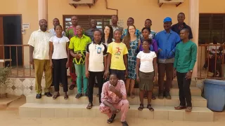 A picture of Hannah with the staff from ESI Benin.